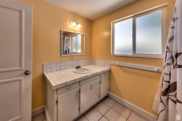 414 W Park Dr W Unit 14, Moab, UT 84532 - full bathroom with baseboards, tile patterned flooring, and vanity