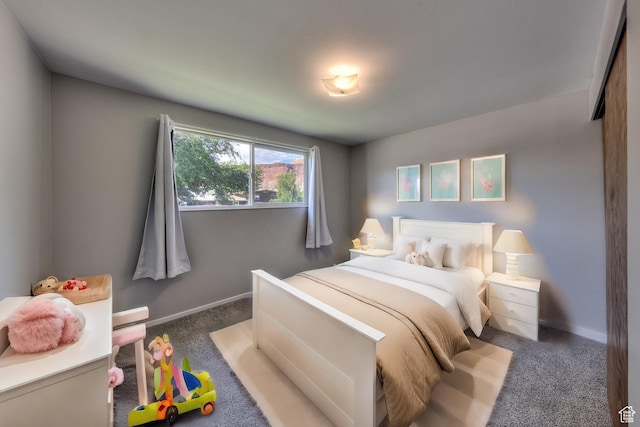 414 W Park Dr W Unit 14, Moab, UT 84532 - bedroom featuring baseboards and carpet flooring