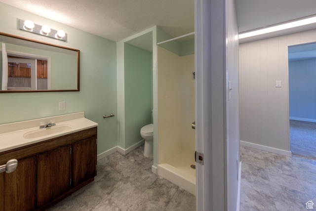 414 W Park Dr W Unit 14, Moab, UT 84532 - full bath featuring toilet, vanity, baseboards, and a shower stall