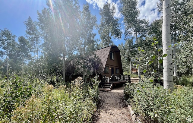 11523 E Cliffrose Dr E Unit 1692, Heber City, UT 84032 - view of side of property with roof with shingles, a deck, and a gambrel roof