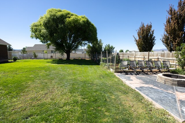 310 S 100 W, Centerfield, UT 84622 - view of yard featuring a patio area and an outdoor fire pit