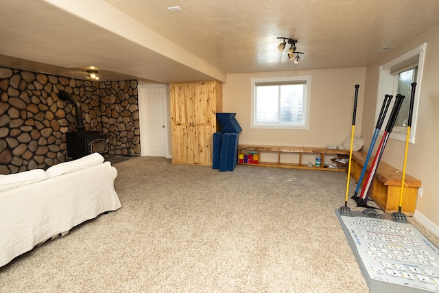 310 S 100 W, Centerfield, UT 84622 - recreation room featuring a textured ceiling, carpet, and a wood stove