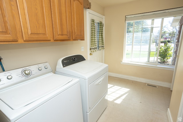 310 S 100 W, Centerfield, UT 84622 - laundry area featuring light tile patterned floors, independent washer and dryer, and cabinets