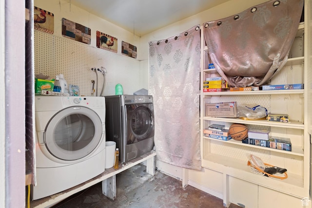 washroom with laundry area and washing machine and clothes dryer