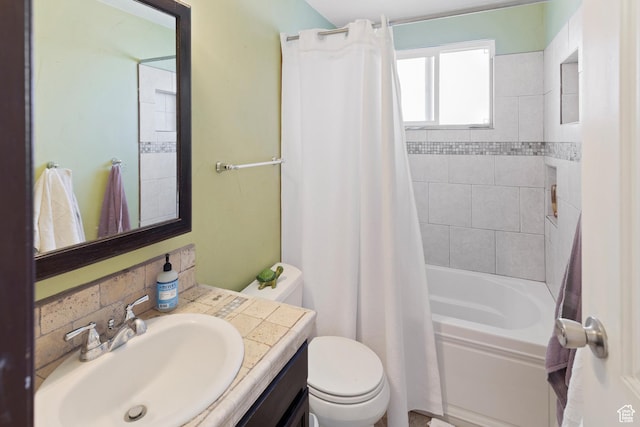 full bathroom with shower / bath combo with shower curtain, vanity, and toilet