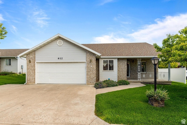 612 E 1280 N, Logan, UT 84341 - single story home with a porch, a garage, and a front lawn