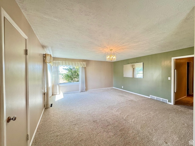 186 S 100 E St E, Laketown, UT 84038 - carpeted empty room with visible vents, a textured ceiling, baseboards, and an inviting chandelier