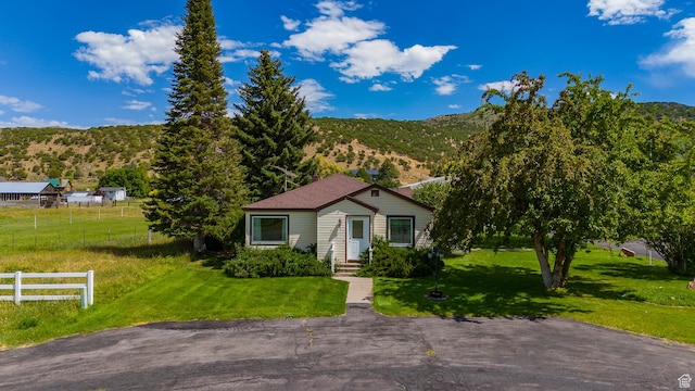 186 S 100 E St E, Laketown, UT 84038 - view of front of property with a front lawn, fence, and a mountain view
