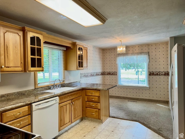 186 S 100 E St E, Laketown, UT 84038 - kitchen featuring wallpapered walls, glass insert cabinets, white appliances, and a sink