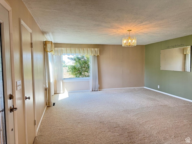 186 S 100 E St E, Laketown, UT 84038 - spare room featuring carpet floors, an inviting chandelier, baseboards, and a textured ceiling