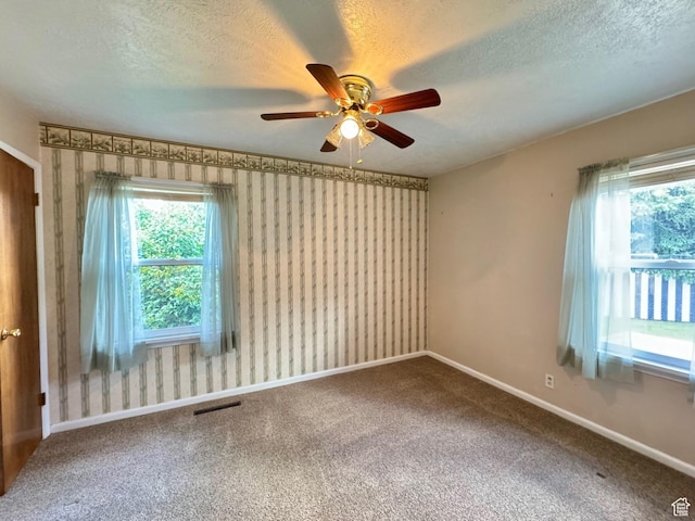 186 S 100 E St E, Laketown, UT 84038 - carpeted empty room featuring a textured ceiling, baseboards, visible vents, and wallpapered walls