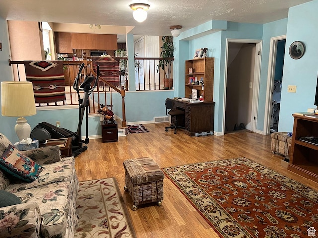 3383 W 6880 S, West Jordan, UT 84084 - living area featuring baseboards, wood finished floors, and visible vents
