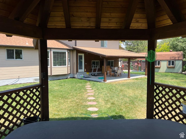 3383 W 6880 S, West Jordan, UT 84084 - exterior space featuring a gazebo, a lawn, an outbuilding, a patio, and roof with shingles