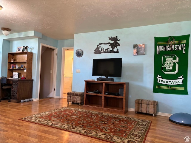 3383 W 6880 S, West Jordan, UT 84084 - living room with baseboards, wood finished floors, and a textured ceiling