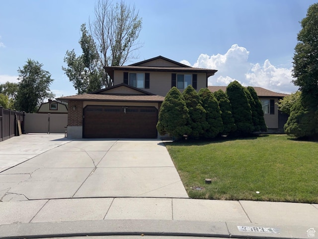 3383 W 6880 S, West Jordan, UT 84084 - view of front of house with driveway, an attached garage, fence, a front yard, and brick siding