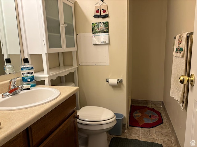 3383 W 6880 S, West Jordan, UT 84084 - bathroom featuring baseboards, vanity, and toilet