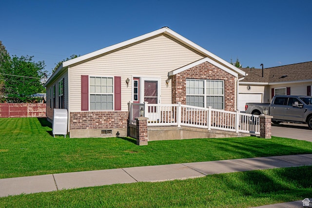 80 E 300 N Unit 3, Preston, ID 83263 - view of front of house featuring an attached garage, brick siding, fence, and a front yard