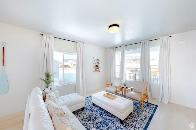 2216 S Beachcomber Ln, Garden City, UT 84028 - living area featuring plenty of natural light and wood finished floors