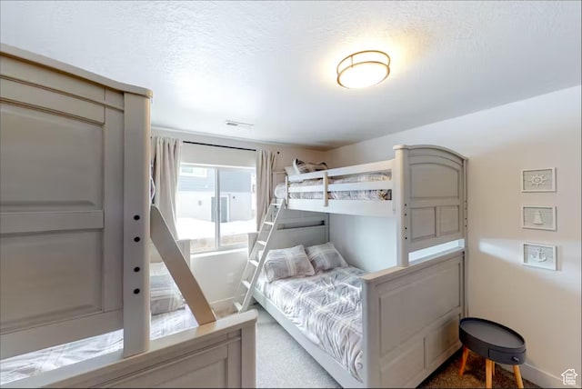 2216 S Beachcomber Ln, Garden City, UT 84028 - bedroom featuring visible vents and a textured ceiling