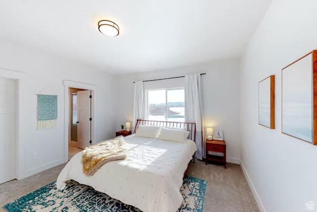 2216 S Beachcomber Ln, Garden City, UT 84028 - bedroom featuring light colored carpet and baseboards