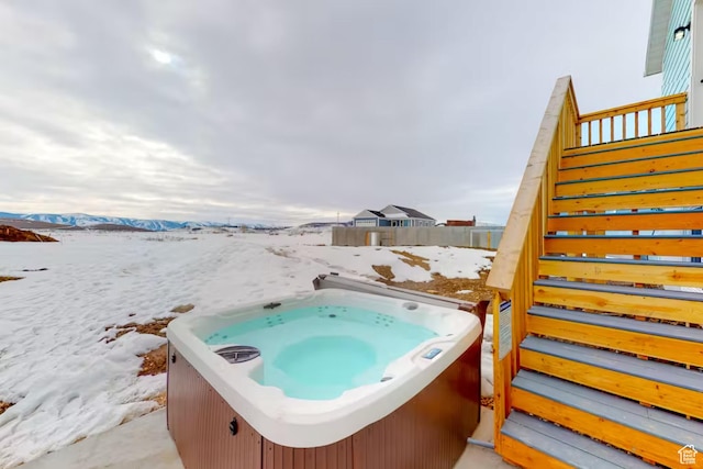2216 S Beachcomber Ln, Garden City, UT 84028 - view of patio / terrace with a mountain view, a hot tub, and stairs