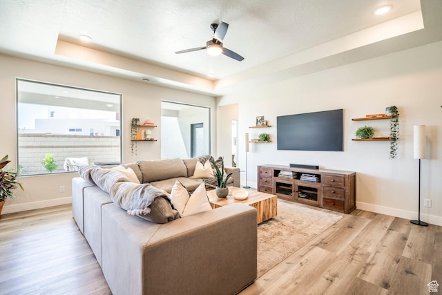 581 W Cypress Umber Dr Unit 34, St George, UT 84790 - living room with a raised ceiling, light wood-style flooring, ceiling fan, baseboards, and recessed lighting