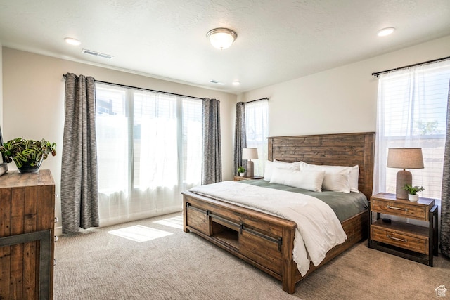 581 W Cypress Umber Dr Unit 34, St George, UT 84790 - bedroom with light carpet and recessed lighting
