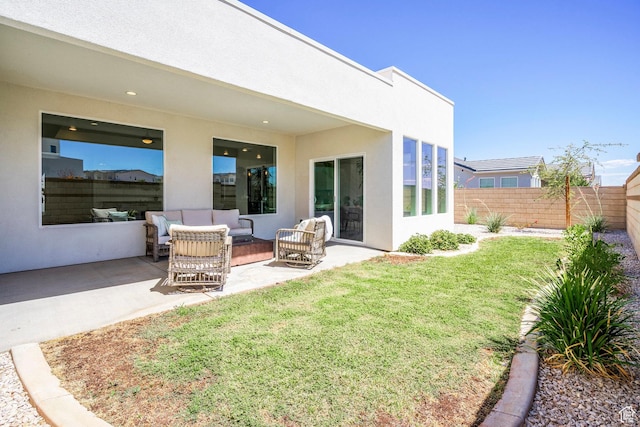 581 W Cypress Umber Dr Unit 34, St George, UT 84790 - back of house with a patio area, stucco siding, and outdoor lounge area