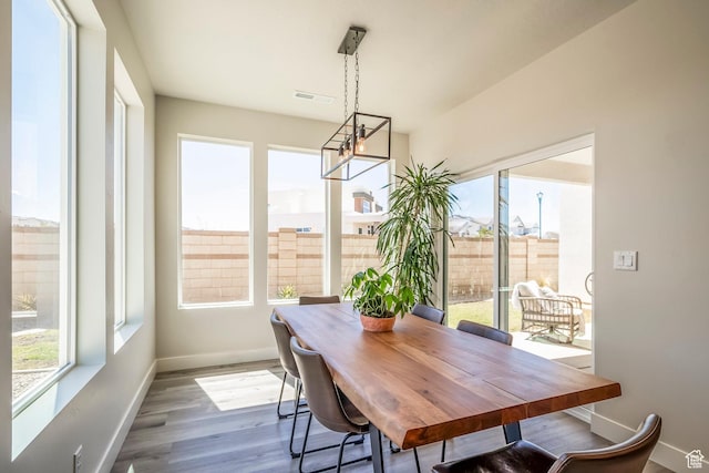 581 W Cypress Umber Dr Unit 34, St George, UT 84790 - dining room with a chandelier, plenty of natural light, baseboards, and wood finished floors