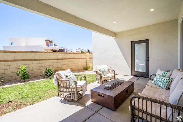581 W Cypress Umber Dr Unit 34, St George, UT 84790 - view of patio with an outdoor living space with a fire pit and fence