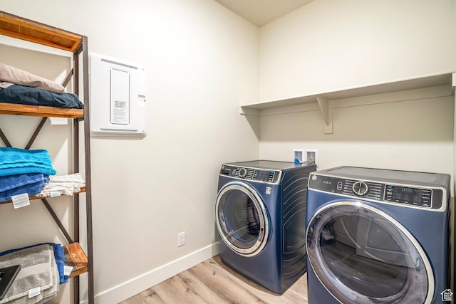581 W Cypress Umber Dr Unit 34, St George, UT 84790 - washroom with separate washer and dryer, light wood finished floors, and baseboards