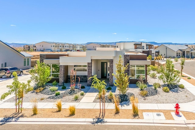 581 W Cypress Umber Dr Unit 34, St George, UT 84790 - contemporary house with a residential view, stucco siding, and stone siding