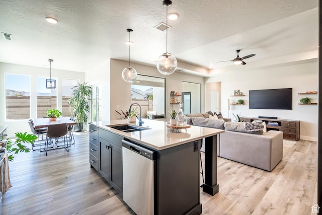 581 W Cypress Umber Dr Unit 34, St George, UT 84790 - kitchen with a sink, dishwasher, plenty of natural light, a ceiling fan, and a textured ceiling