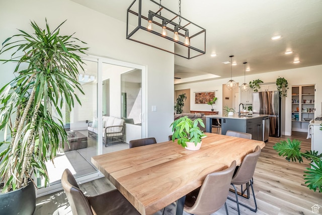 581 W Cypress Umber Dr Unit 34, St George, UT 84790 - dining room with light wood-type flooring, a chandelier, and recessed lighting