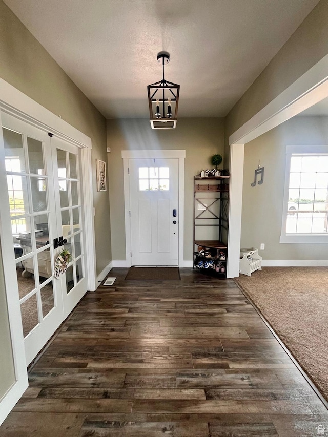 1579 N 2200 E, Preston, ID 83263 - foyer with a wealth of natural light, french doors, a chandelier, and dark wood finished floors
