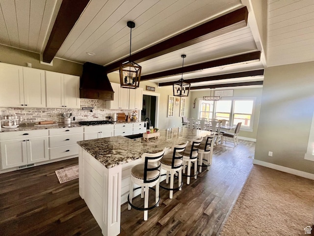 1579 N 2200 E, Preston, ID 83263 - kitchen with gas stovetop, white cabinetry, a sink, custom range hood, and beam ceiling