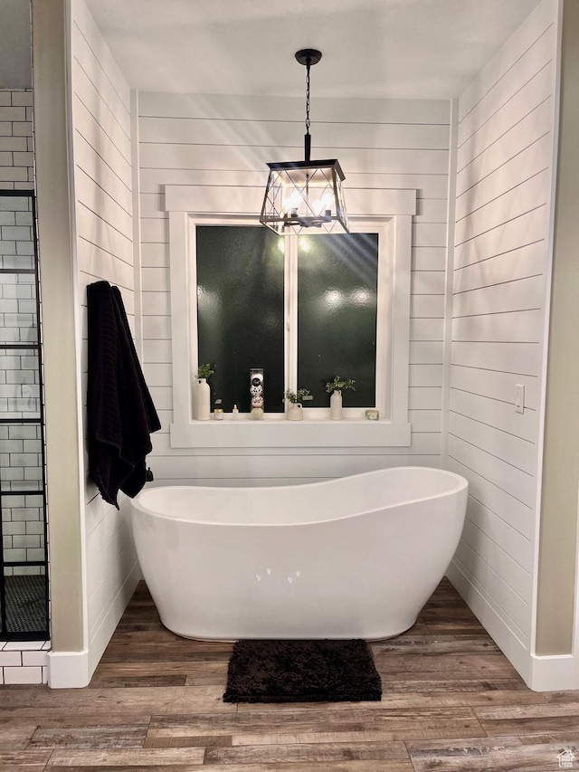 1579 N 2200 E, Preston, ID 83263 - full bath with a freestanding bath, wood finished floors, baseboards, and a stall shower
