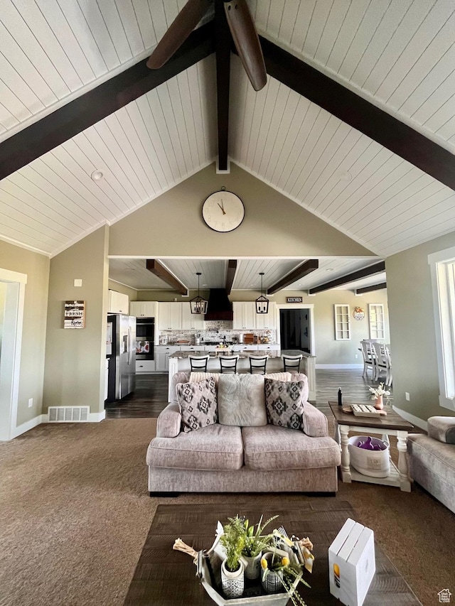 1579 N 2200 E, Preston, ID 83263 - living area with dark colored carpet, visible vents, baseboards, and wood ceiling