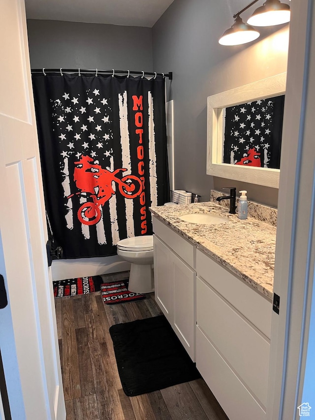 1579 N 2200 E, Preston, ID 83263 - bathroom featuring curtained shower, vanity, toilet, and wood finished floors