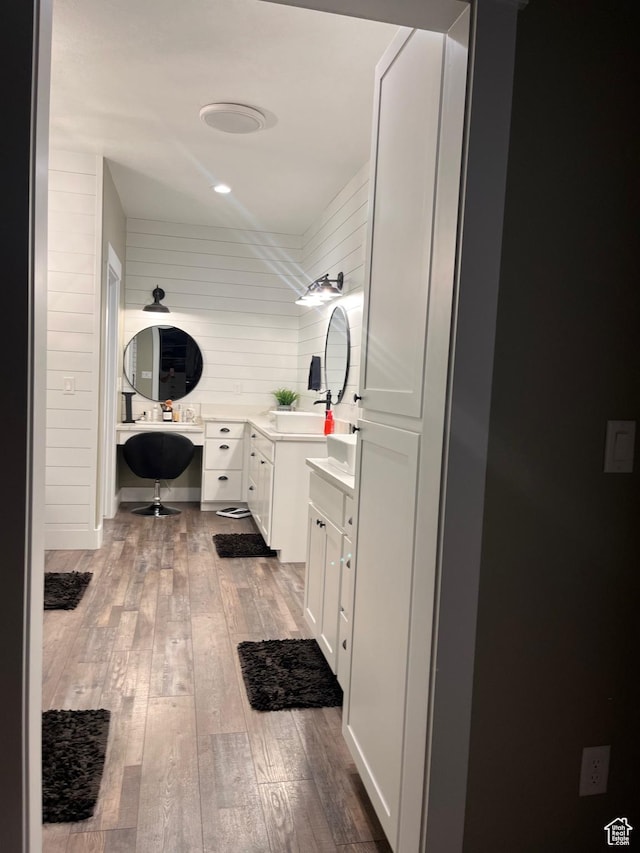 1579 N 2200 E, Preston, ID 83263 - full bath with wooden walls, vanity, and hardwood / wood-style flooring