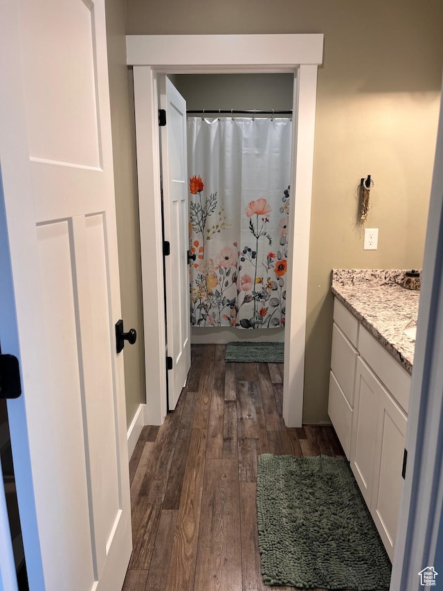 1579 N 2200 E, Preston, ID 83263 - full bathroom featuring curtained shower, wood finished floors, and vanity