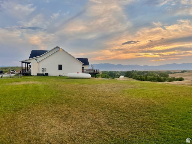 1579 N 2200 E, Preston, ID 83263 - view of side of home with a mountain view and a lawn