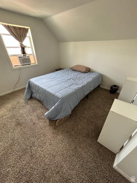 bedroom featuring vaulted ceiling, carpet flooring, and baseboards