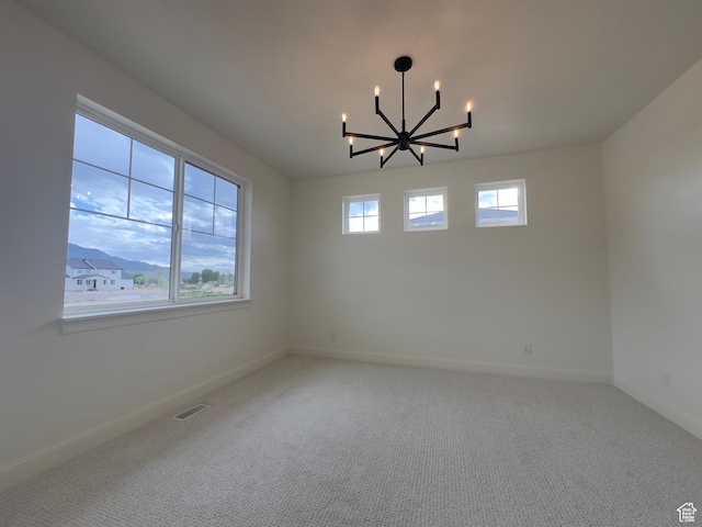 16 W 650 N Unit 1, Salem, UT 84653 - carpeted spare room with a chandelier and baseboards