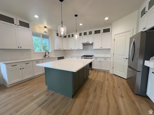 16 W 650 N Unit 1, Salem, UT 84653 - kitchen featuring appliances with stainless steel finishes, under cabinet range hood, a sink, light countertops, and recessed lighting