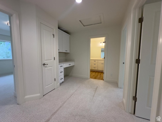 16 W 650 N Unit 1, Salem, UT 84653 - hallway with light colored carpet, baseboards, a desk, and attic access