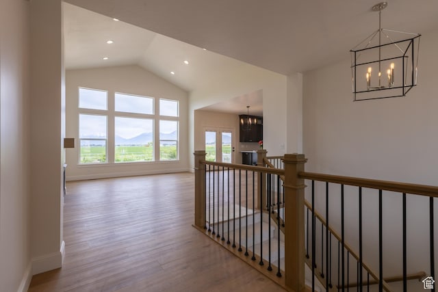 52 W 650 N Unit 3, Salem, UT 84653 - hall with a chandelier, an upstairs landing, wood finished floors, vaulted ceiling, and baseboards
