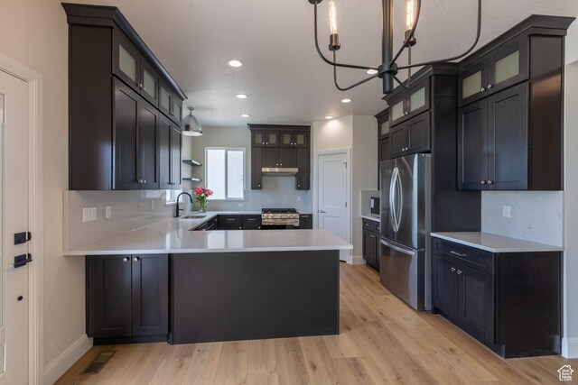 52 W 650 N Unit 3, Salem, UT 84653 - kitchen with appliances with stainless steel finishes, a sink, a peninsula, light wood-type flooring, and recessed lighting