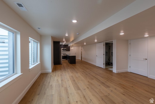 52 W 650 N Unit 3, Salem, UT 84653 - unfurnished living room with baseboards, light wood finished floors, and recessed lighting