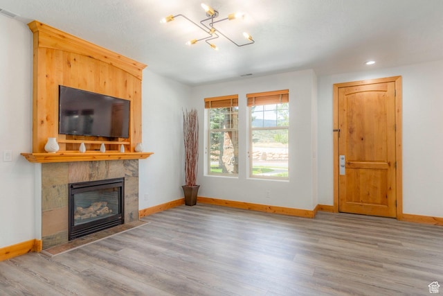 1746 W Redstone Ave # G, Park City, UT 84098 - living room with a tile fireplace and light hardwood / wood-style flooring